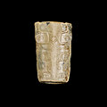 A cylindrical jade 'taotie' bead, shang dynasty