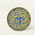 An exceptionally rare yellow-ground blue and white 'phoenix' dish, jiajing mark and period (1522-1566)