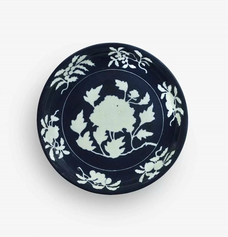 An Exceptionally Rare and Large Fine Blue and White Reserve-Decorated ‘Peony’ Dish, Xuande Mark and Period