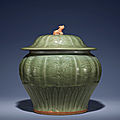 A carved 'Longquan' celadon jar and cover, guan, Yuan Dynasty (1279-1368)