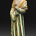 A sancai-glazed pottery figureof a standing lady, Tang dynasty (AD 618-907)