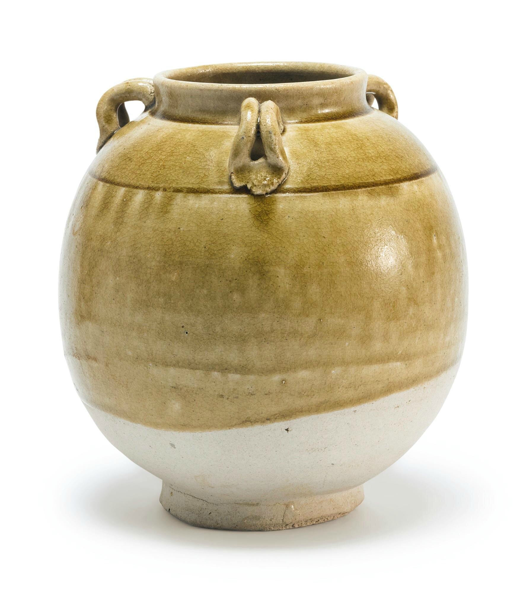 An olive green-glazed stoneware jar, Sui dynasty