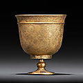 A small finely engraved gilt-silver stem cup, tang dynasty (ad 618-907)