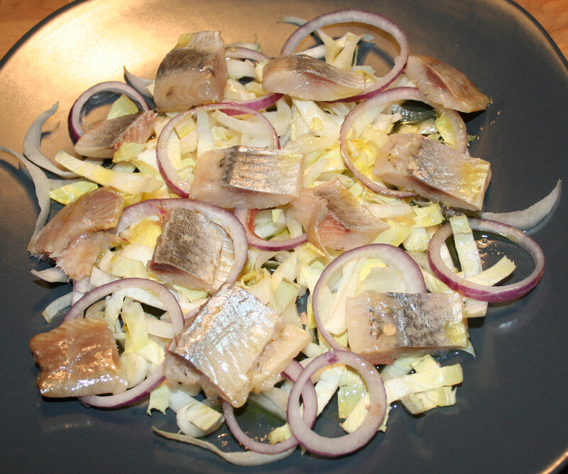 Filets de harengs fumés sur salade d