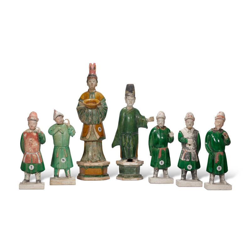 group of seven green and amber glazed pottery figures