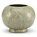 A carved Yue celadon jar, Five Dynasties (907-960)