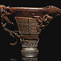 An impressive large archaistic rhinoceros horn 'Nine Dragons' libation cup, 17th century