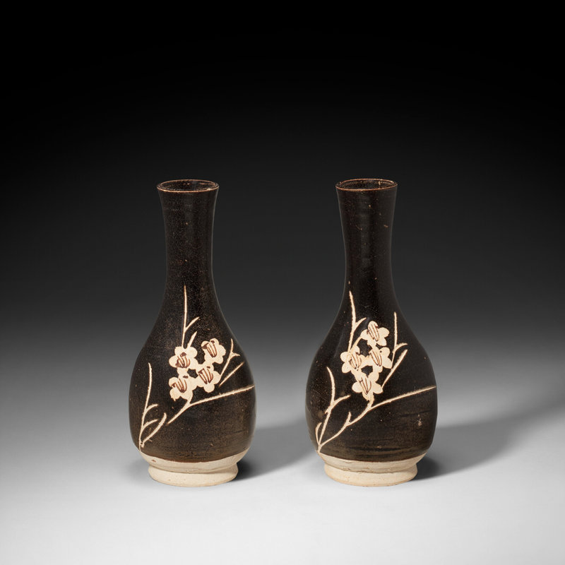 A pair of 'Jizhou' resist-decorated 'prunus' bottle vases, Southern Song-Yuan dynasty, 13th-14th century