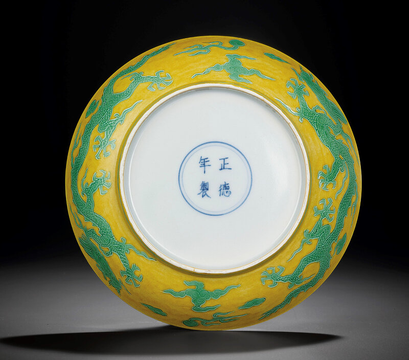 A yellow-ground green-enamelled 'Dragon' dish, Zhengde four-character mark within double-circles and of the period (1506-1521) (2)