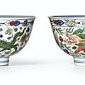 A fine pair of wucai 'dragon and phoenix' bowls, marks and period of kangxi (1662-1722)