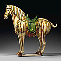 A large and finely modeled sancai-glazed pottery figure of a ferghana horse, tang dynasty (ad 618-907)