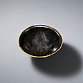 An extremely rare dingyao gilt-decorated black-glazed 'floral' bowl, northern song dynasty