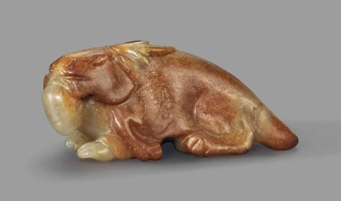 A rare celadon and russet jade carving of Zhou Yanzi, Ming dynasty, 17th century