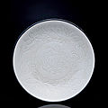 A rare and finely carved ding dragon dish, northern song dynasty, 10th-12th century