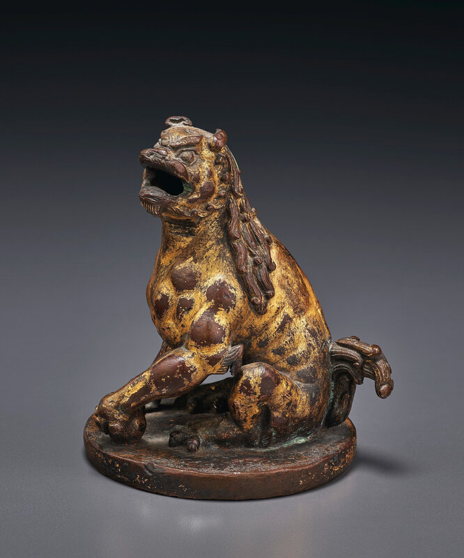 2020_NYR_19039_0902_000(a_rare_gilt-bronze_figure_of_a_seated_roaring_lion_china_tang-song_dyn032240)