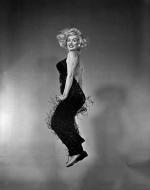 1959-10-NY-Jump_sitting-black_dress-by_halsman-012-1