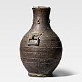 An archaic bronze 'tiger' ritual wine vessel, hu, warring states period (475-221 bc)