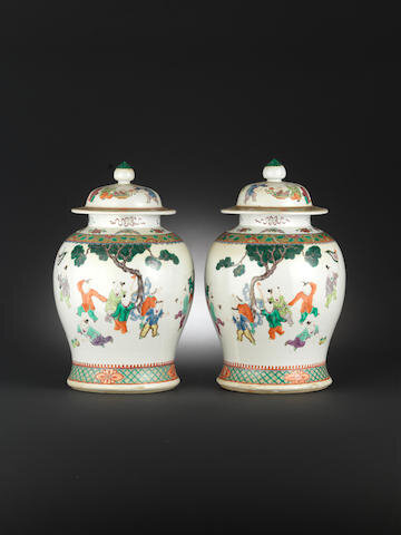 A pair of famille rose baluster jars and two covers, 19th century