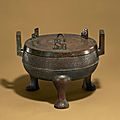 An archaic bronze ritual food vessel and cover, ding, warring states period (b.c. 475-221)  