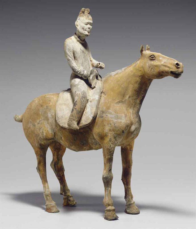 A rare painted grey pottery figure of an equestrian, Tang dynasty (618-907) 