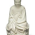 A 'dehua' figure of tudi gong, qing dynasty, kangxi period (1662-1722)