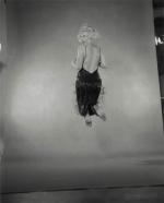1959-10-NY-Jump_sitting-black_dress-by_halsman-035-1
