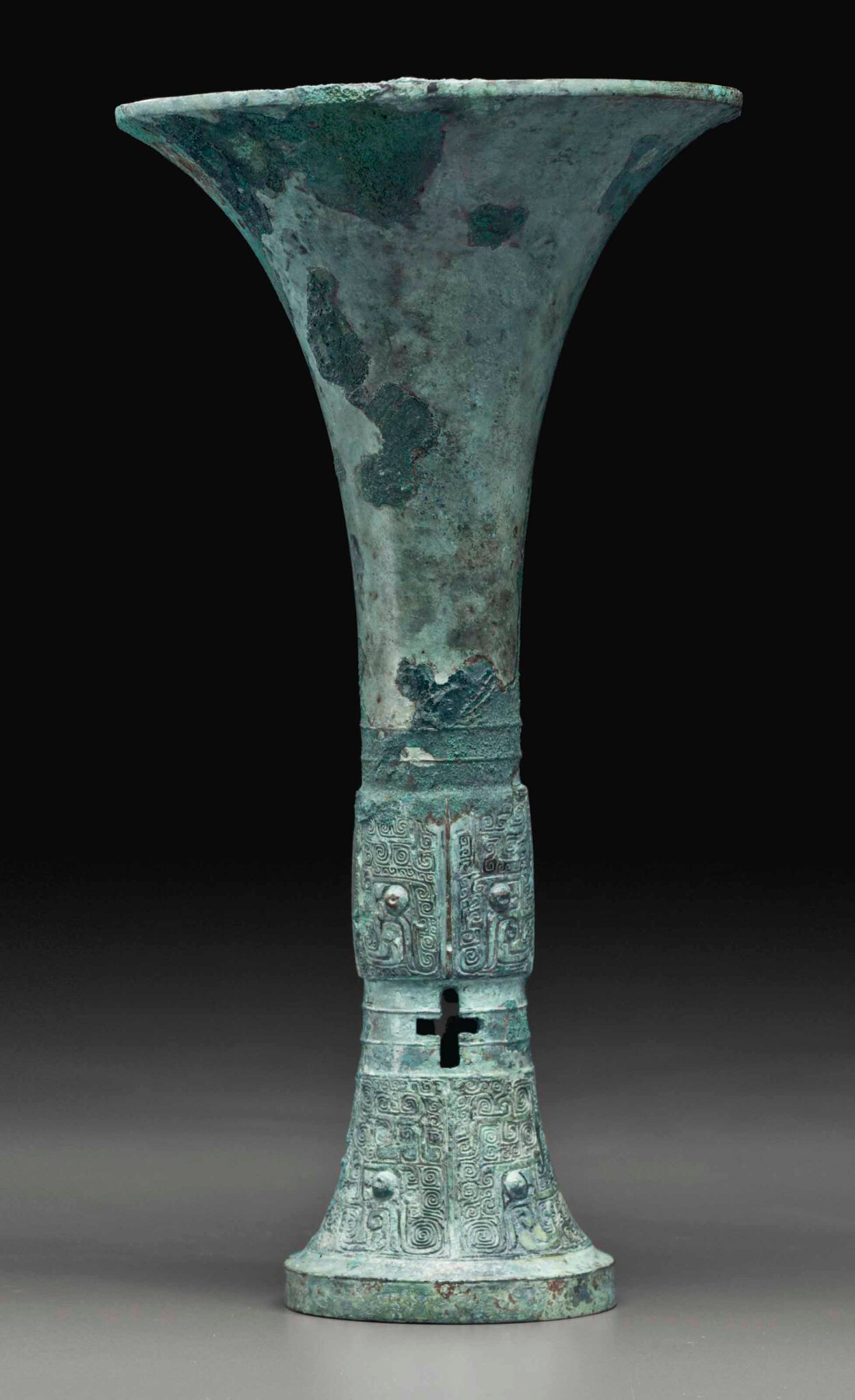 An archaic bronze ritual tripod wine vesse, gu, Late Shang dynasty, 12th-11th century BC