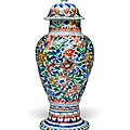 A wucai moulded slender baluster vase and cover, qing dynasty, kangxi period (1662-1722)