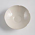 A fine light cream glazed blossom-shaped ding bowl, song dynasty (960-1279)