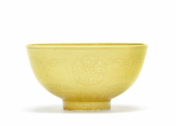 A yellow-glazed incised 'floral medallions' bowl, Guangxu six-character ...