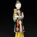 A rare gilt and polychrome enameled export porcelain figure of a female attendant. qianlong period 