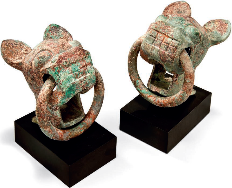 A pair of archaic bronze animal-head chariot fittings, Warring States period (475-221 BC)