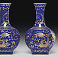 A pair of gilt-decorated blue-ground bottle vases, guangxu six-character marks in gilding and of the period (1875-1908)