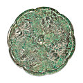 A bronze octalobed 'floral' mirror, Tang Dynasty (618-907)