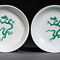 A rare pair of green-enamelled dragon anhua wave dishes, underglaze blue Hongzhi six-character marks and probably of the period