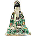 A biscuit-glazed seated guanyin, kangxi period (1662-1722) 