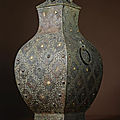 A rare copper-inlaid archaic bronze wine vessel with gilt bosses, fanghu, warring states period, 4th century bc