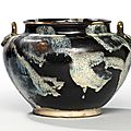 A Lushan phosphatic glaze-splashed brown-glazed foliate-appliqué twin-handled jar, Tang dynasty (618-907)