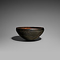 A burnished black pottery alms bowl, patra, Tang dynasty (618-907)