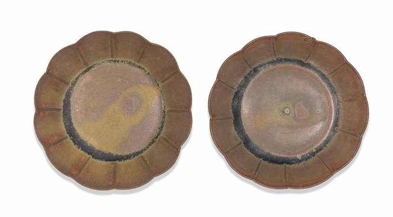 A rare pair of small brown-glazed saucer dishes, 11th-12th century