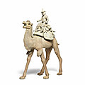 A very large pottery model of a camel and 'foreign' rider, tang dynasty (618-907)