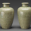 A pair of early celadon carved ovoid vases, southern song dynasty, 12th century