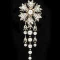 Diamond hair ornament designed as a stylised cornflower mounted ‘en tremblant’