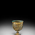 An engraved gilt-bronze stem cup, tang dynasty (618-907)
