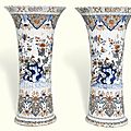 A pair of tall dutch delft polychrome beaker vases, early 18th century