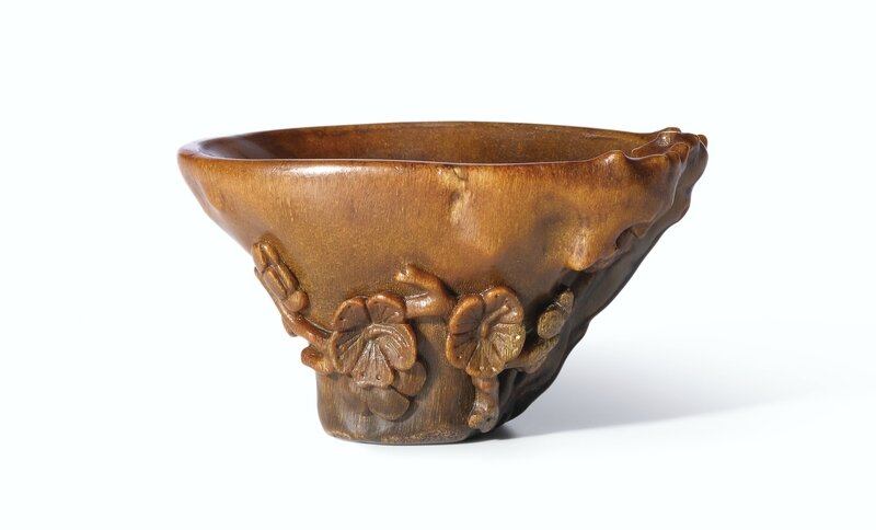 A carved rhinoceros horn 'Prunus' cup, 17th century