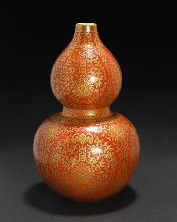 A_coral_red_and_gilt_enameled_porcelain_double_gourd_vase